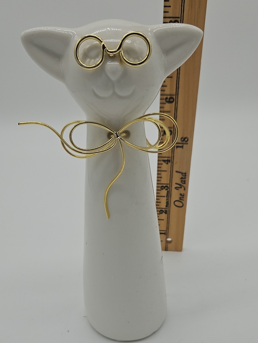Gold Wire Bow Brooch - White Ceramic Display
